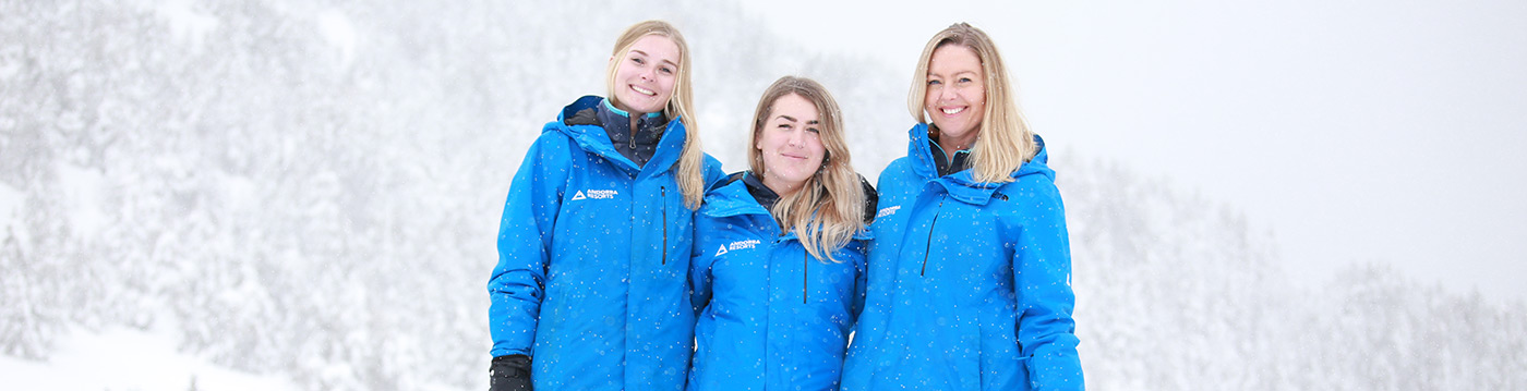 Andorra Resorts team from 2020 laughing in the snow