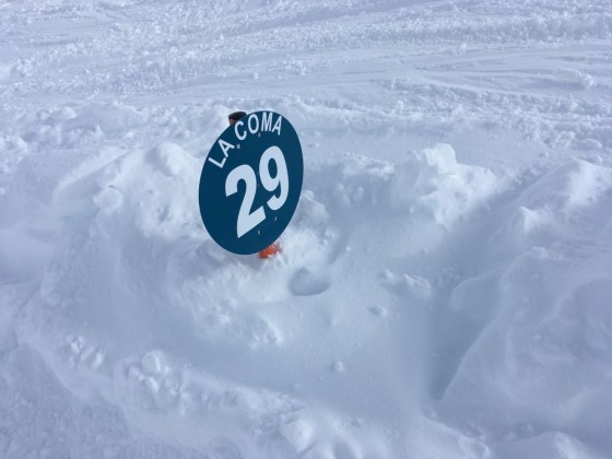 It has snowed that much that piste signs are almost buried