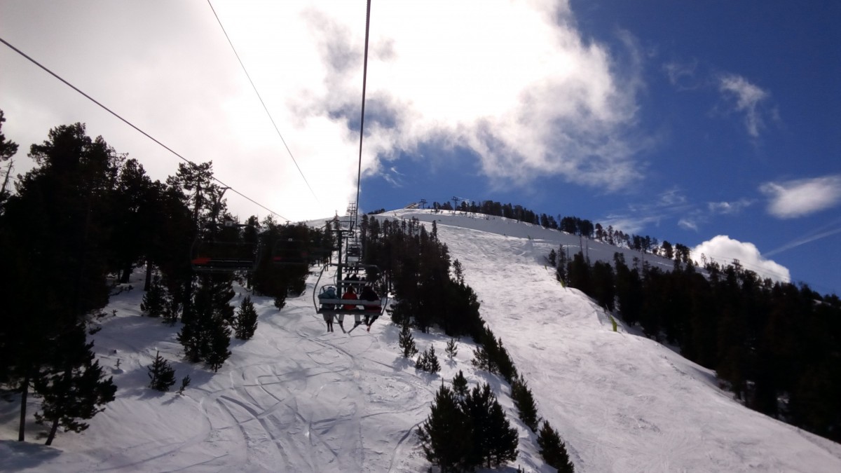 Heading up the chairlift La Botella with some clouds in the sky