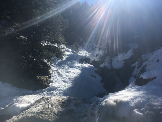 Small waterfall hidden under the snow in Arinsal