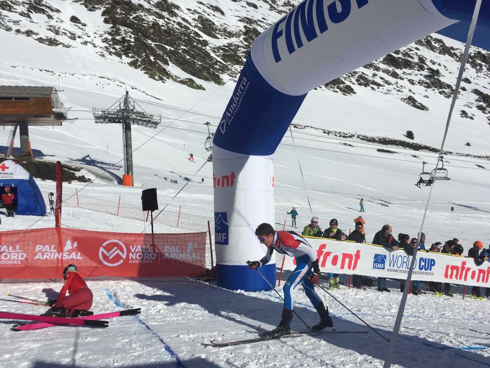 Skier crossing the finish line in Arinsal