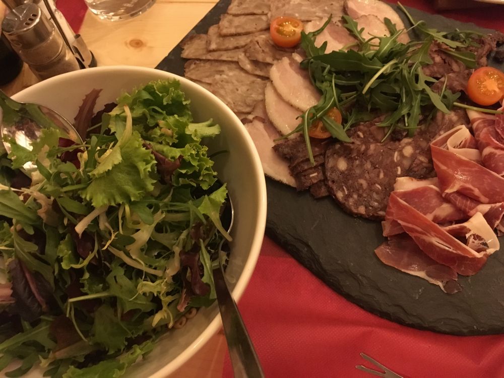 Salad and cold meats for the first course of the fondue meal in Xalet Igloo