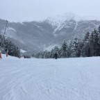 Skiing down blue slope El Bec