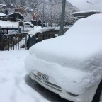 The cars were covered in snow