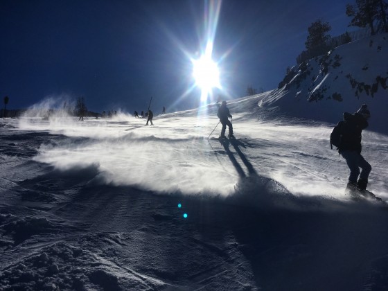 Skiers on Coll de la Botella blue slope