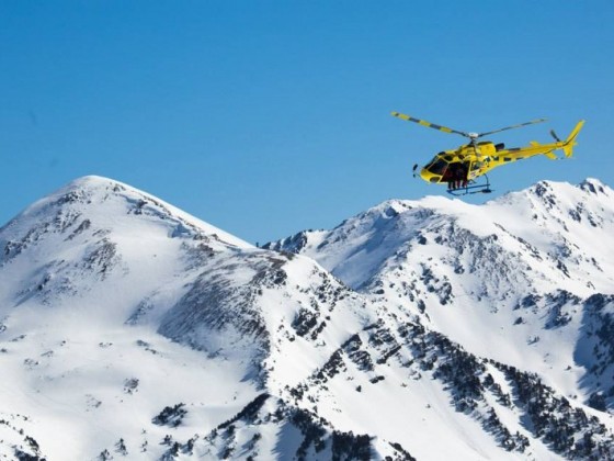 Helicopter flying over the mountains